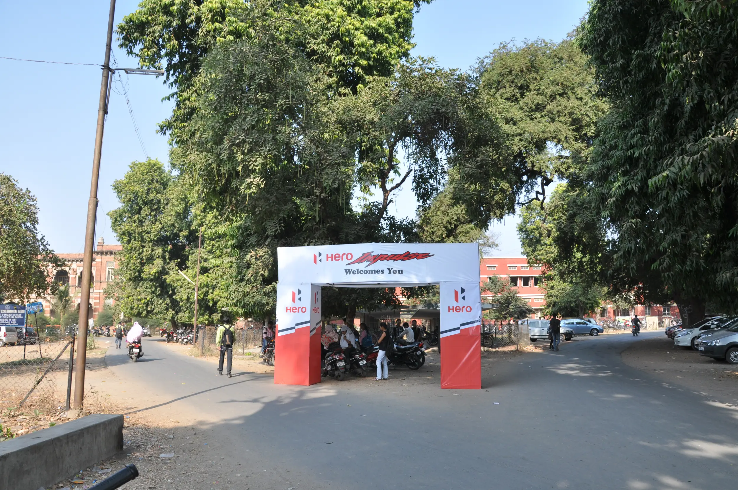 ITT event entrance with red and green carpet and pink lighting on white structure with ITT branding